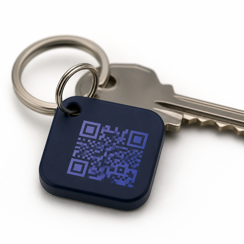 Linko QR keychain tag on a metal ring next to a house key